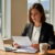 Professional reviewing an employment contract at a desk in Ontario, California.